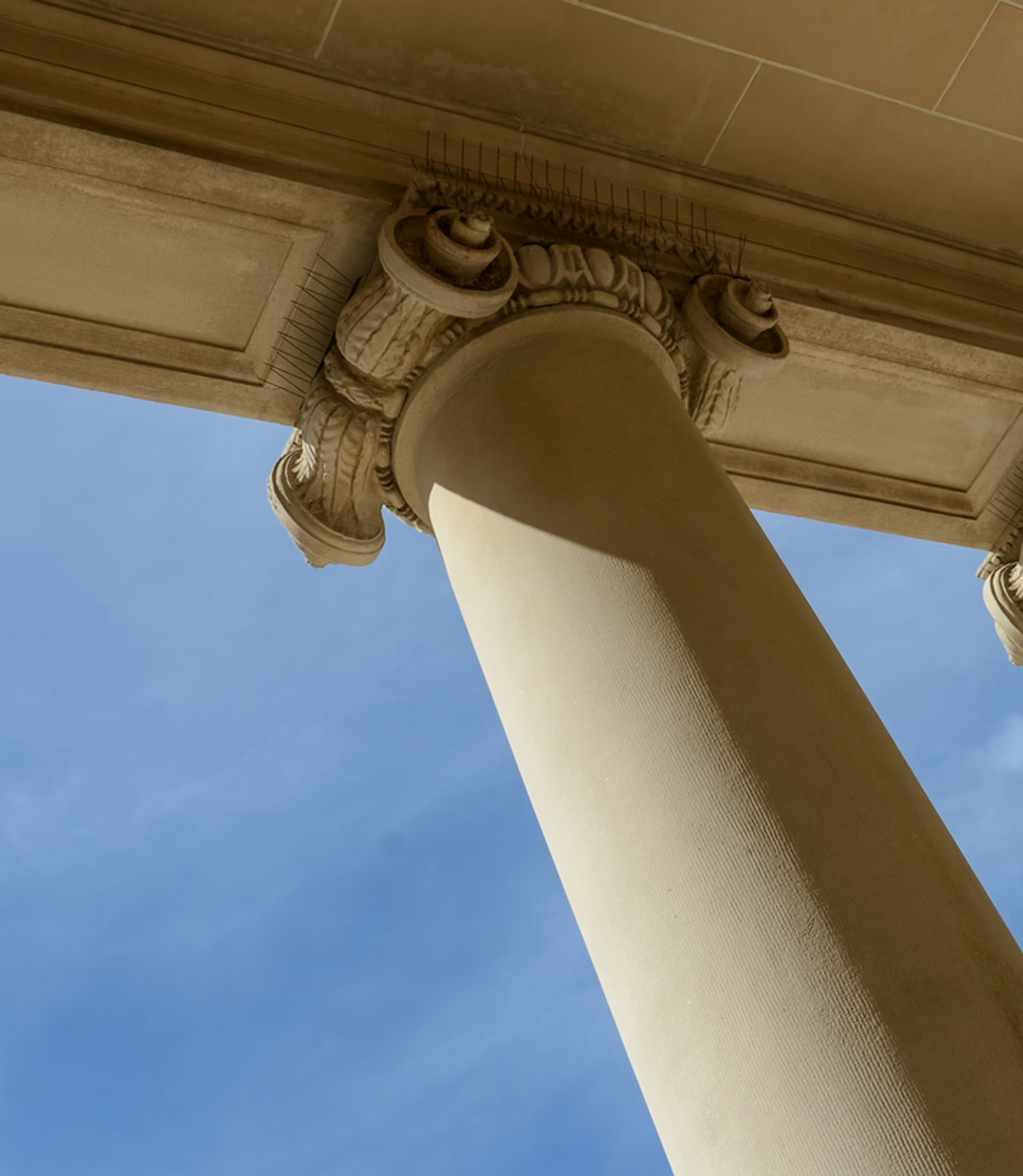 Sunlight falling across a classical stone column